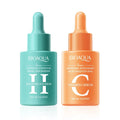 Two Bioaqua serum bottles, one green and one orange, on a white background.