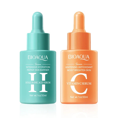 Two Bioaqua serum bottles, one green and one orange, on a white background.