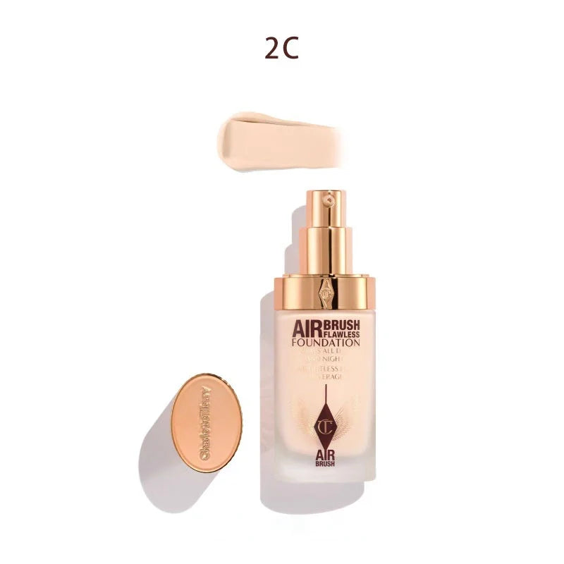 Airbrush foundation bottle with applicator on a white background 2C