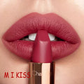 Close-up of a red lipstick being applied to lips with 'MI KISS' branding.