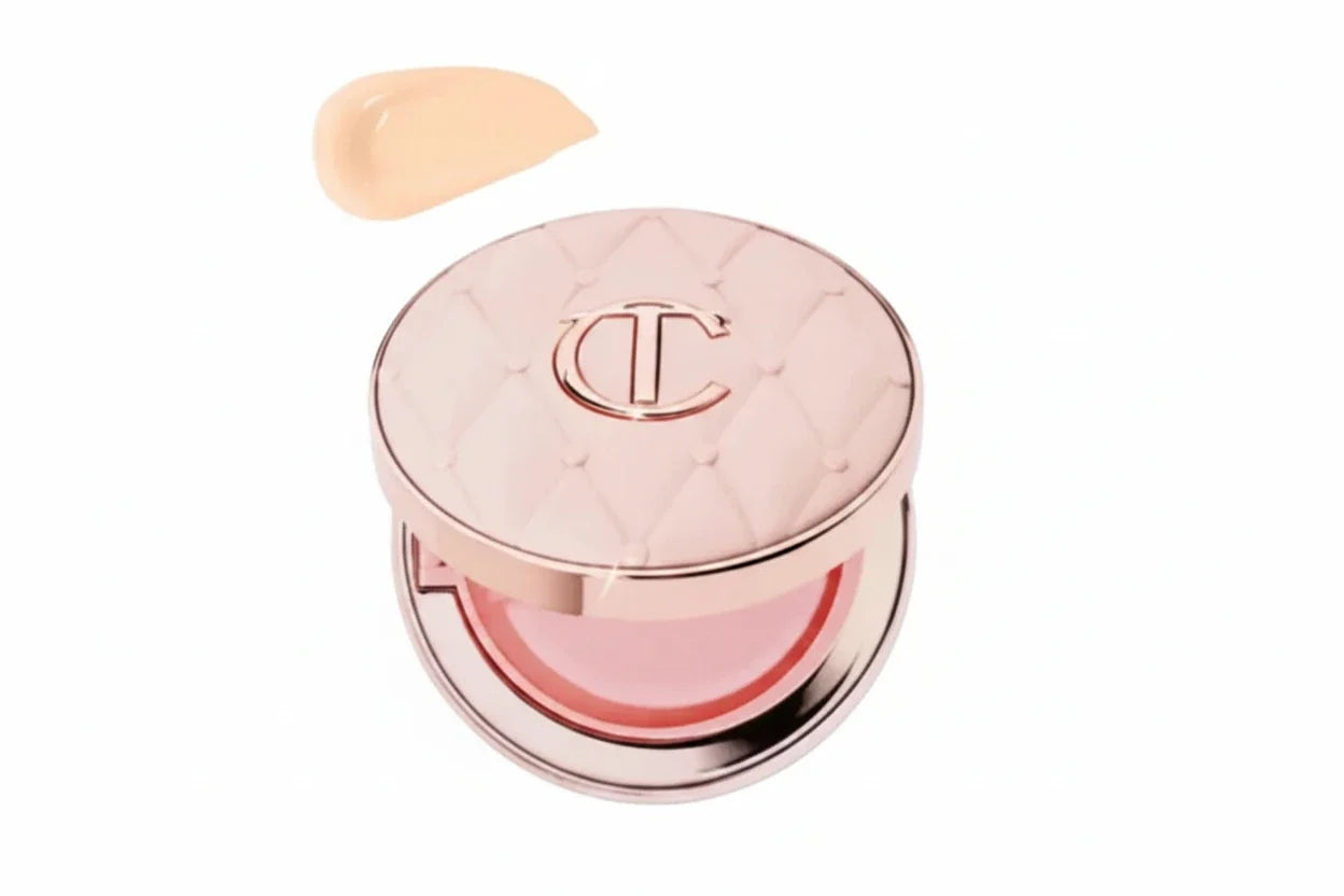 Charlotte Tilbury makeup product with a swatch of color on a white background