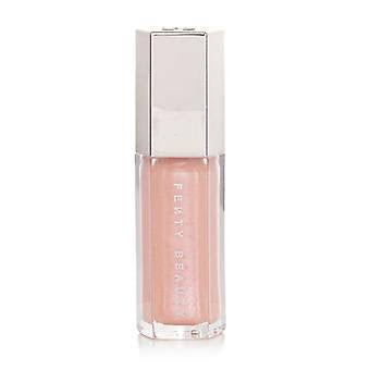Lip gloss with silver cap on a white background
