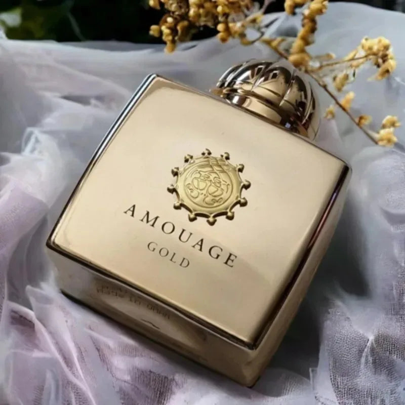 Amouage Gold perfume bottle on a soft fabric background