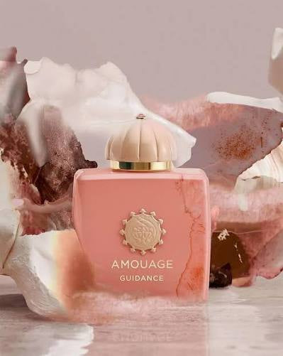 Amouage Guidance perfume bottle with decorative background