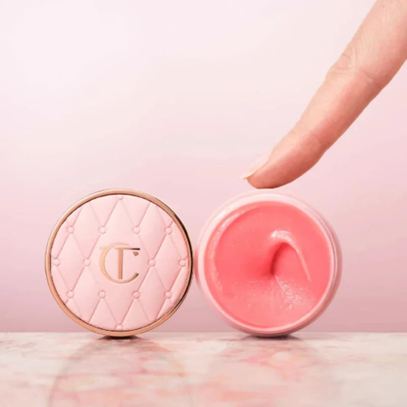 Pink cosmetic product with a textured case on a pink background