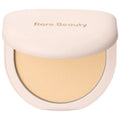 Compact powder with 'Rare Beauty' branding on a white background