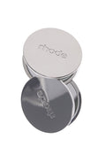 Silver round container with 'rhode' branding on a white background