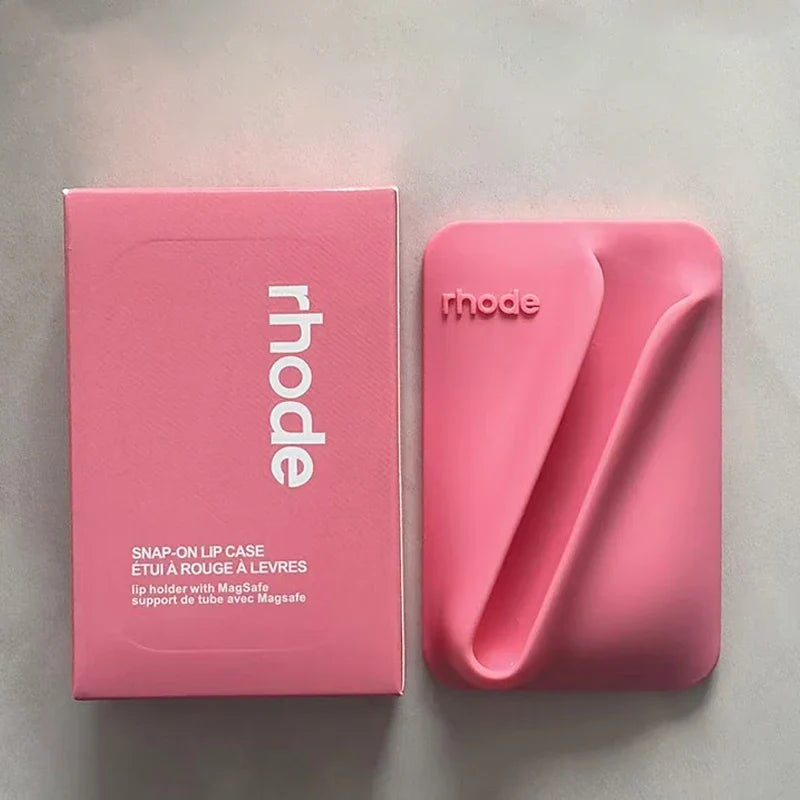 Pink lip case with packaging on a gray background
